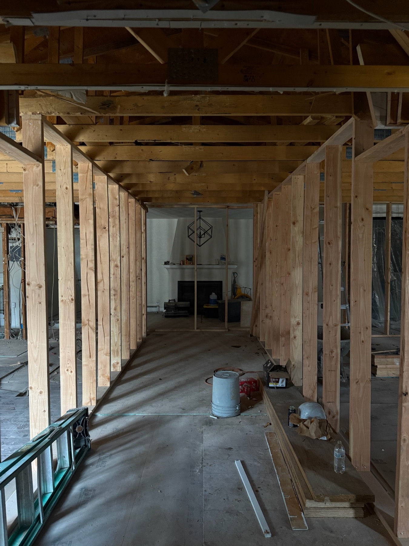 A home mid-construction, framed and taking shape
