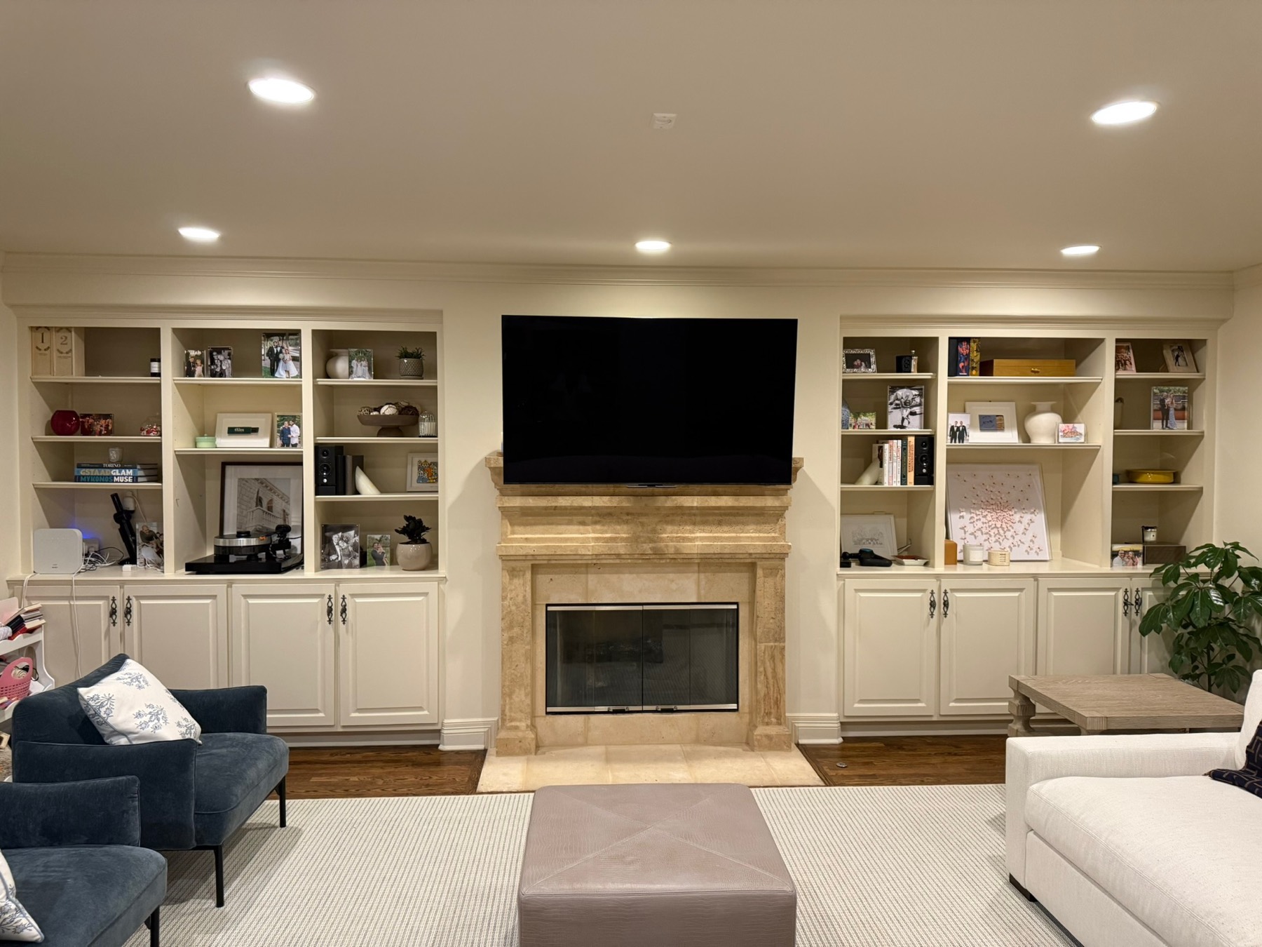 The basement before — unfinished storage with plywood shelves