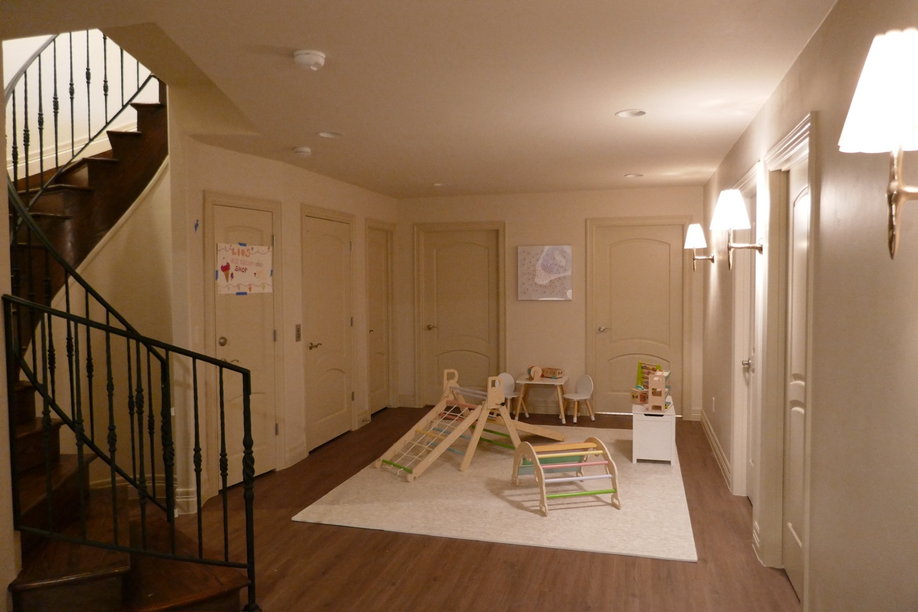 The playroom after — climbing toys and a styled rug