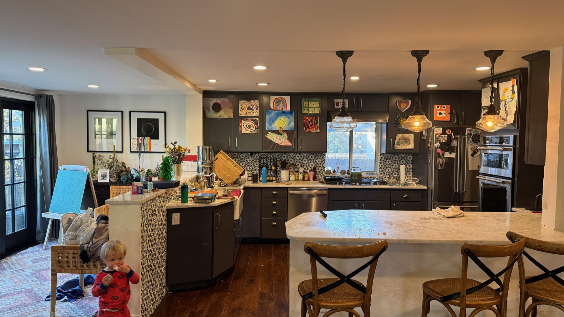 The kitchen before the remodel — dark cabinets and a closed-in layout